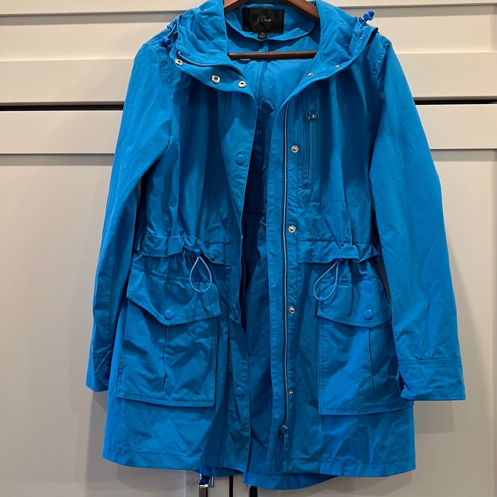 Blue J. Crew women’s hooded rain jacket.  Size small.  Good condition.